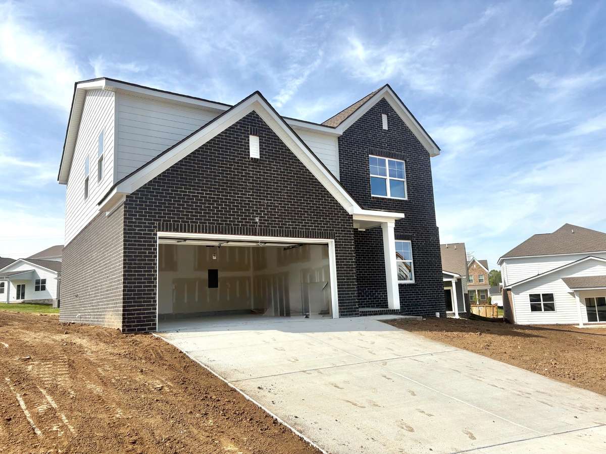 Photo of actual home under construction. Ready to sod this spacious yard!