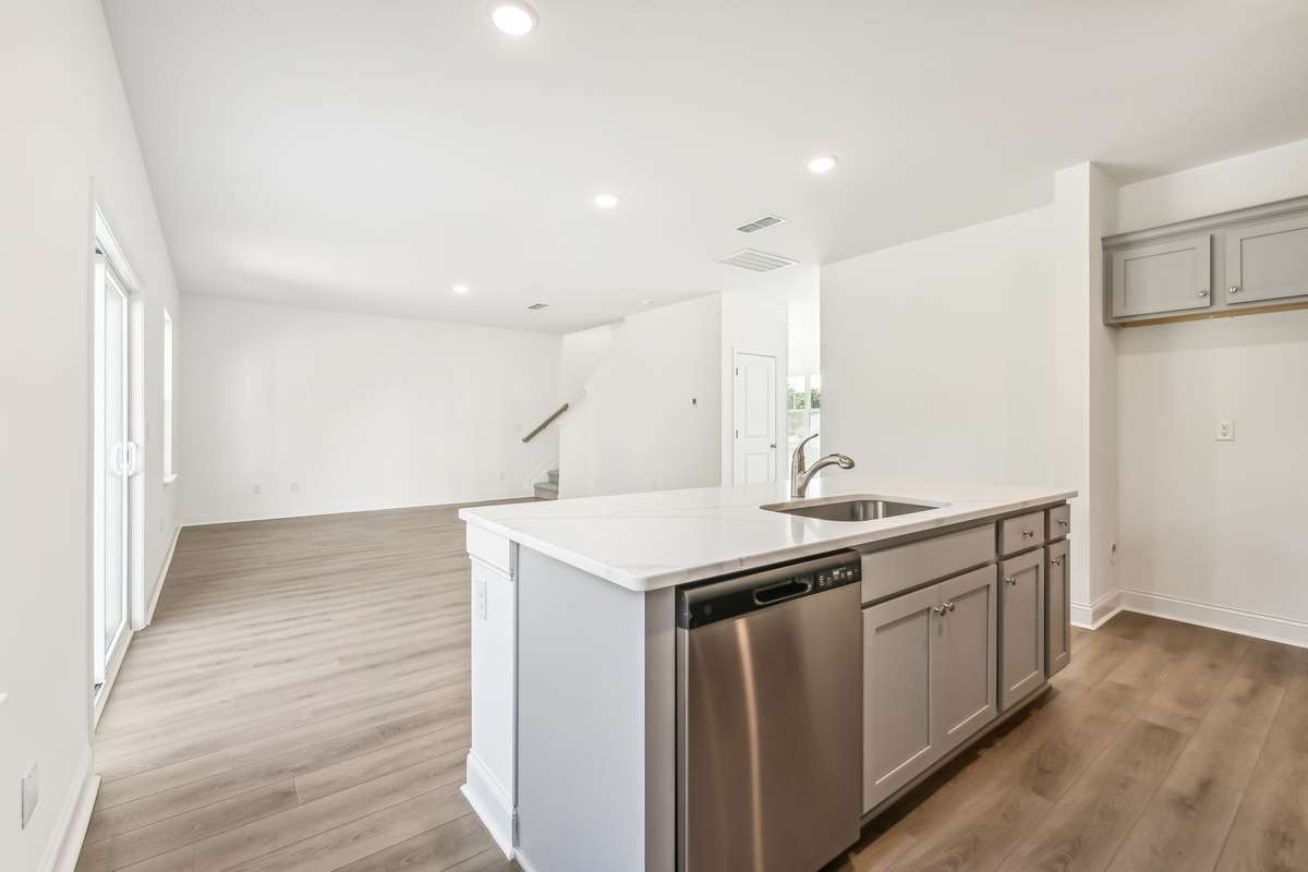 Westmore kitchen and great room. Photo is of similar home, same plan. Options may vary.
