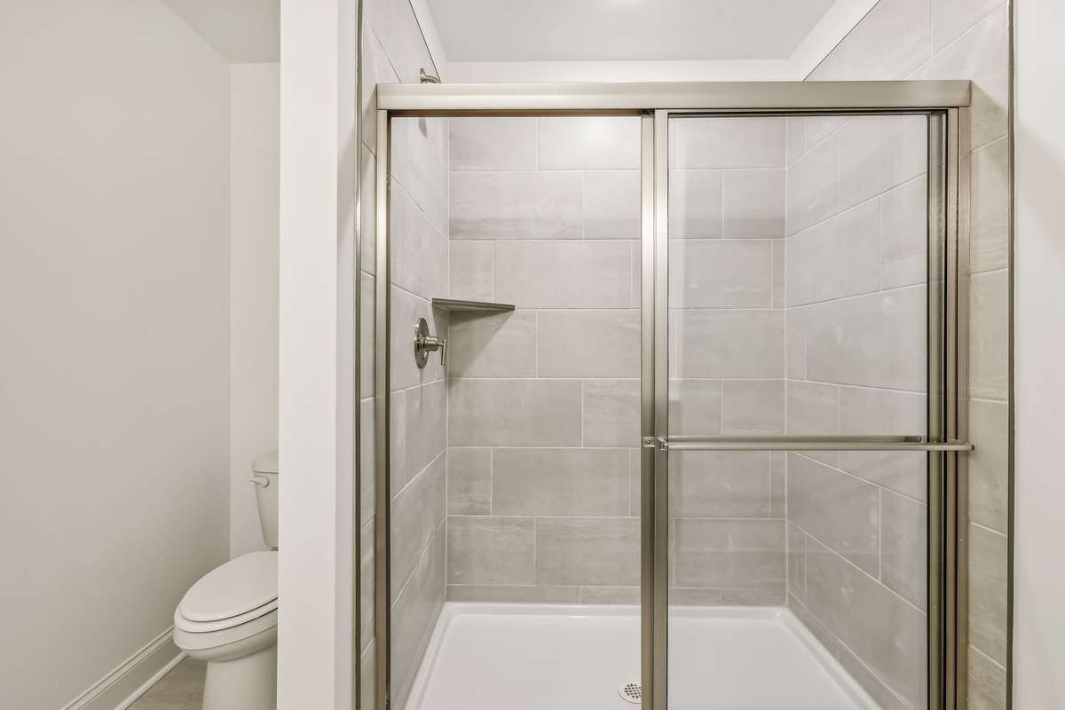 Westmore primary shower Photo is of similar home, same plan. Options may vary.