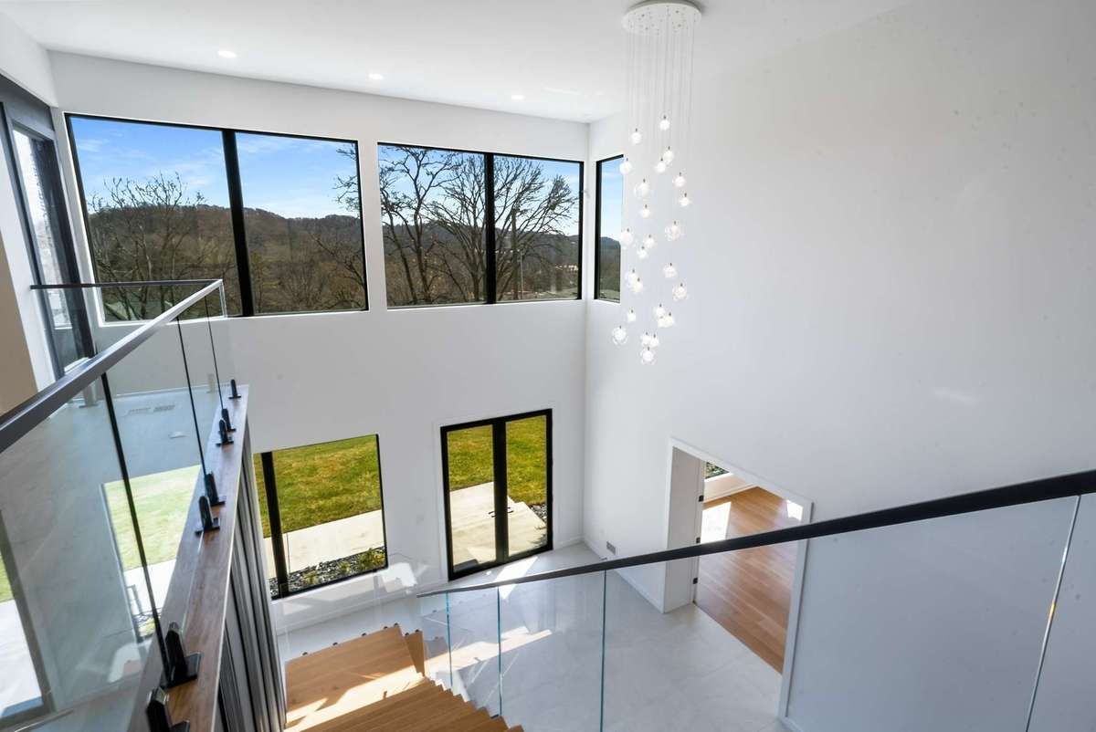 Two story reception as viewed from the top of the stairs a preview of the hillside vista