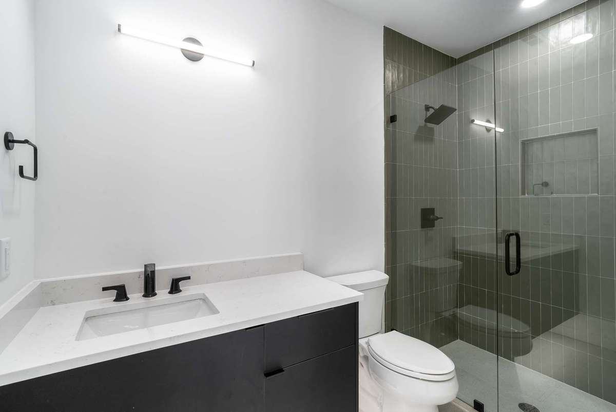 The bedroom 4 bath features a shower. Mirror to be selected.