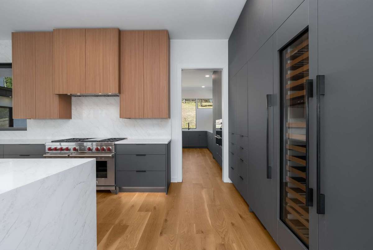 The kitchen continues into the working pantry / skullery