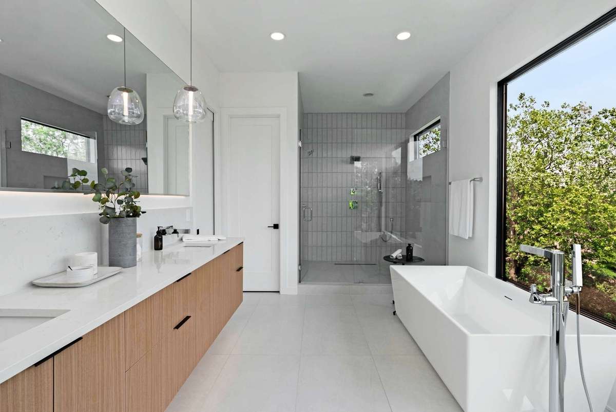 Floating vanity with LED illumination and backlit mirror.