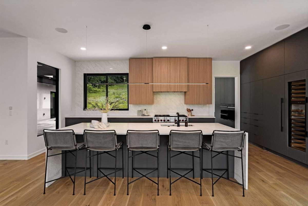 The kitchen is modern and minimal but is packed with features and function.