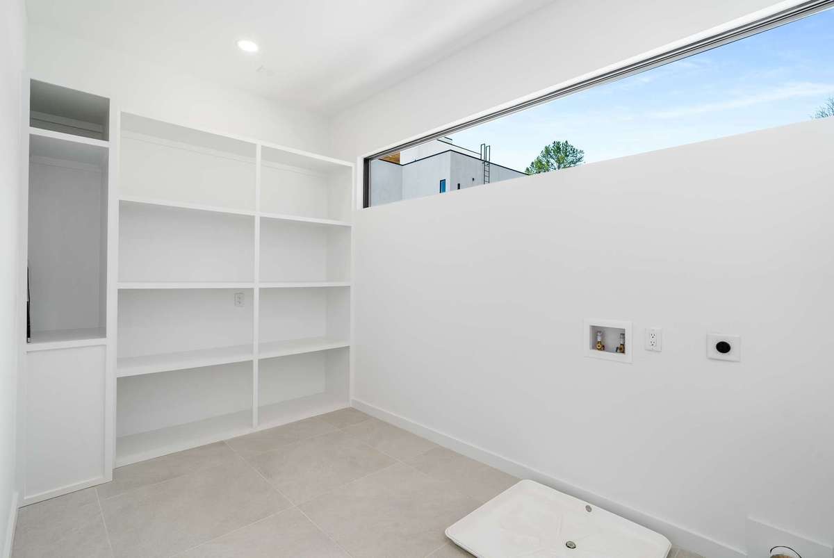 Storage and Laundry with washer/dryer hookups in the family room wing.