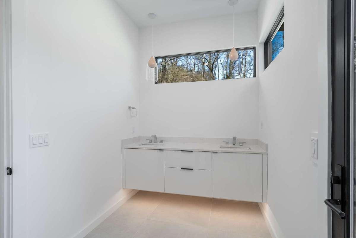 Family room wing full bath with a double vanity