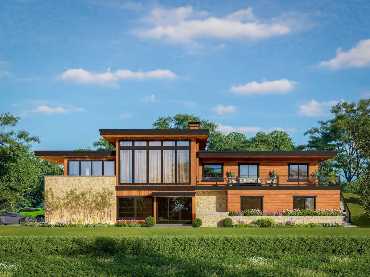 Rear view of home--tons of windows to overlook the gorgeous wooded lot, overlooking the hollow below.