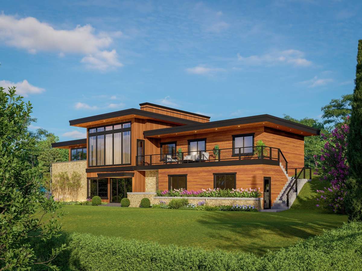 Rear view of home--tons of windows to overlook the gorgeous wooded lot, overlooking the hollow below.