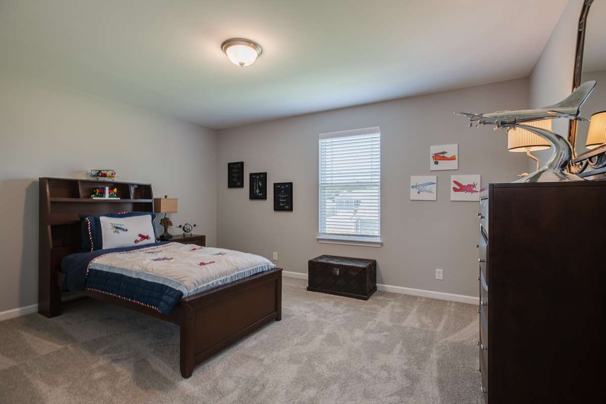 Secondary Bedroom upstairs with a HUGE closet & attic storage space!