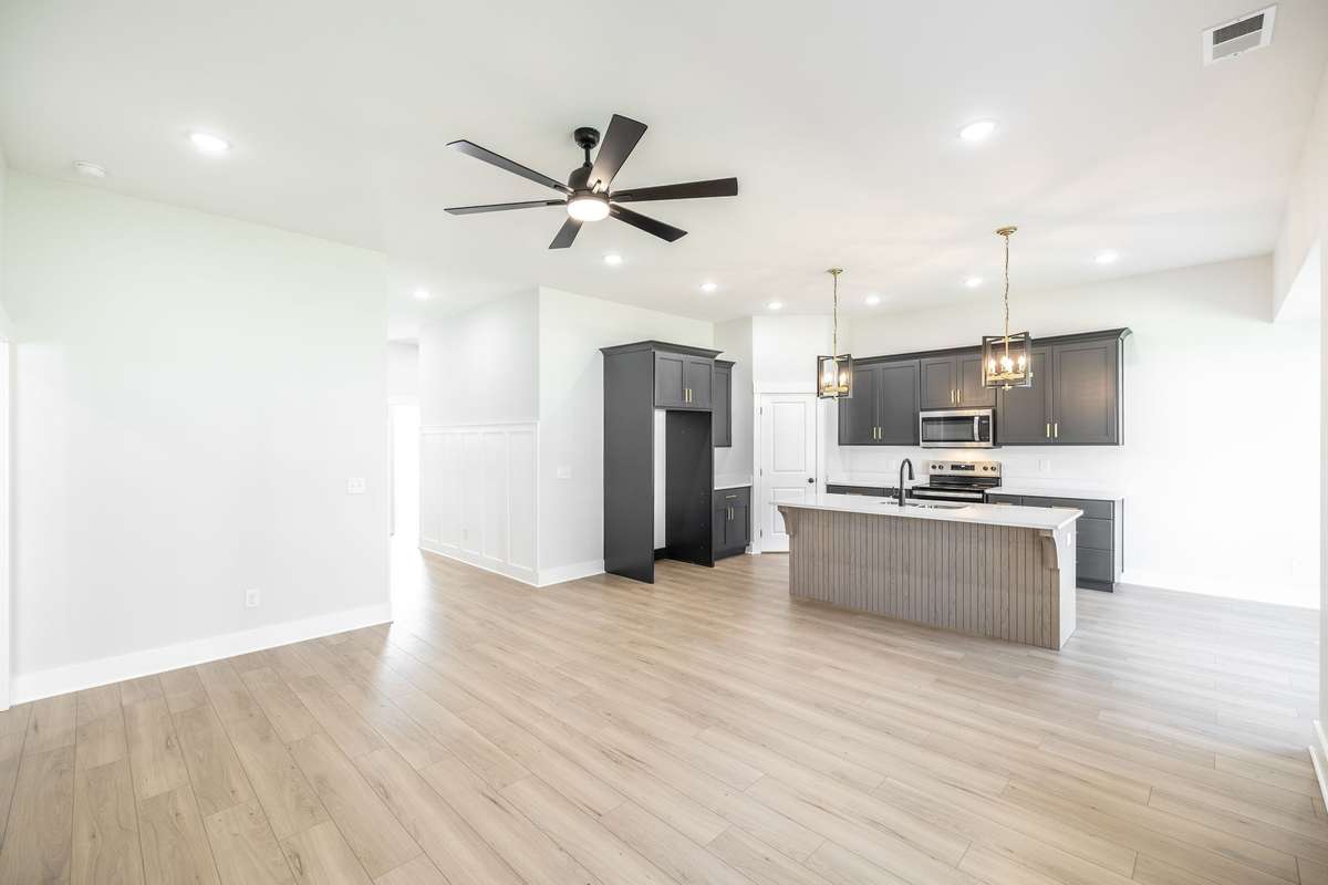 Large open living room & kitchen~LVP flooring throughout!