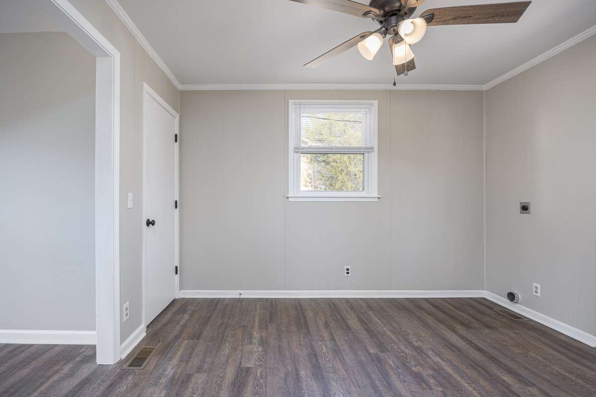 back through the hallway and kitchen; basement door is to your left