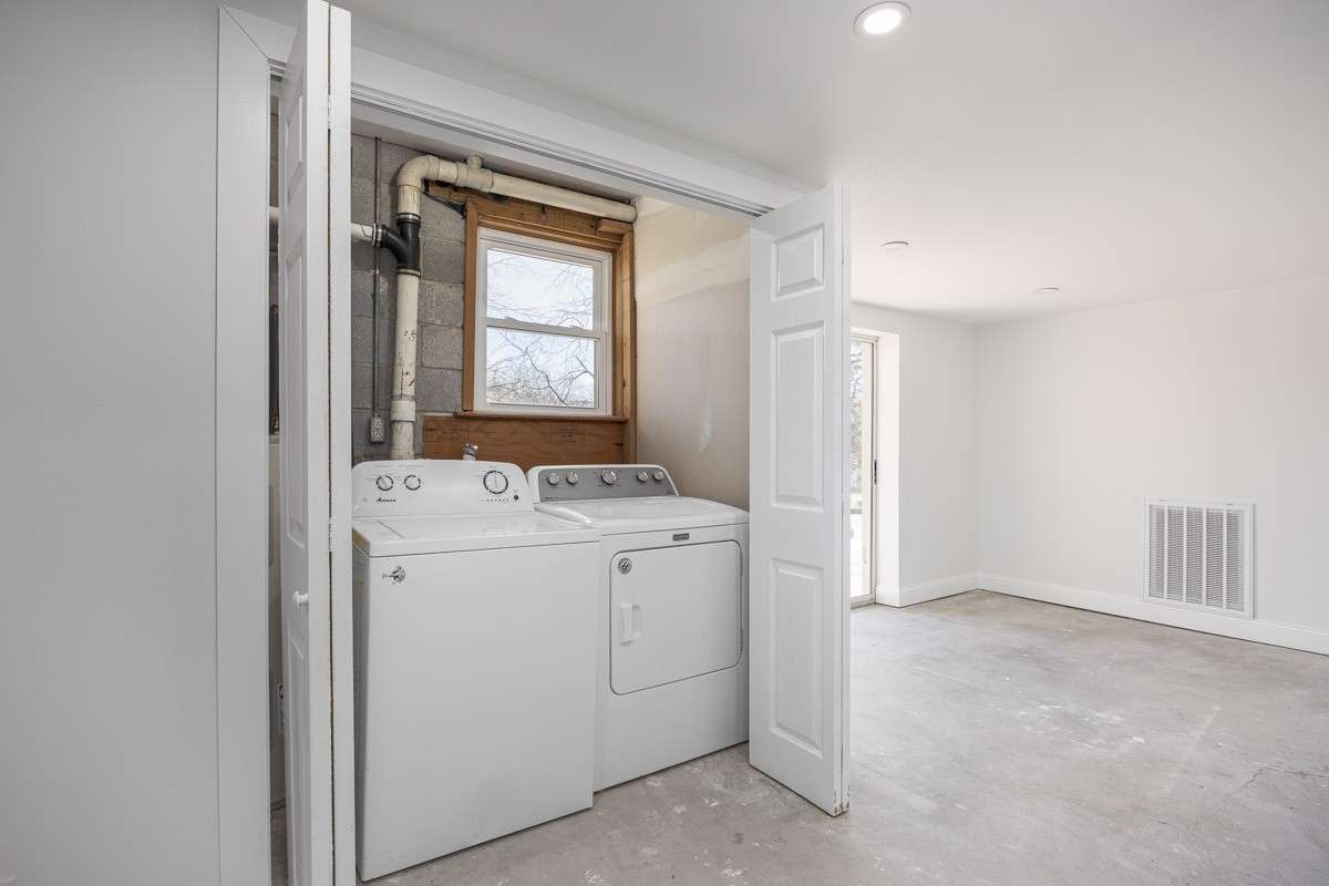 Down here is where the washer and dryer are located currently, tucked in a laundry closet
