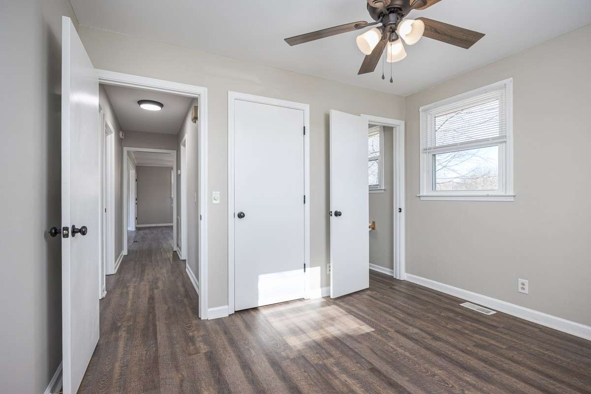 to the left is the hallway leading back to the living area / kitchen, to the right is the half bath ensuite