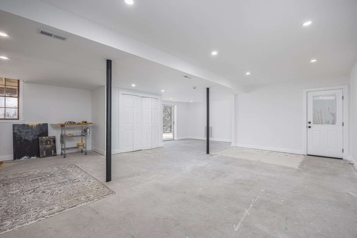 Massive space for you to make your own! Conditioned and Finished, except for the floors - we left them concrete so you can decide how you want to use this space