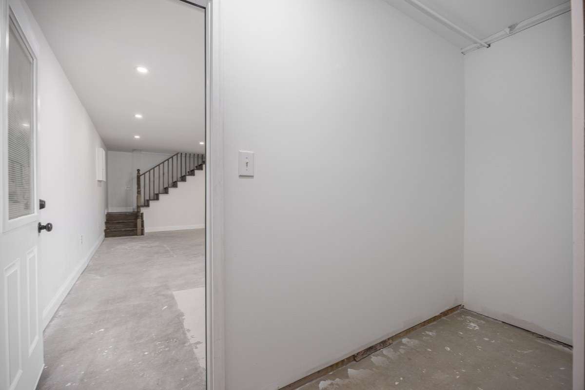 Just past the basement "choose your own adventure" space is a small storage area -- could be a drop zone, because just past it is the garage