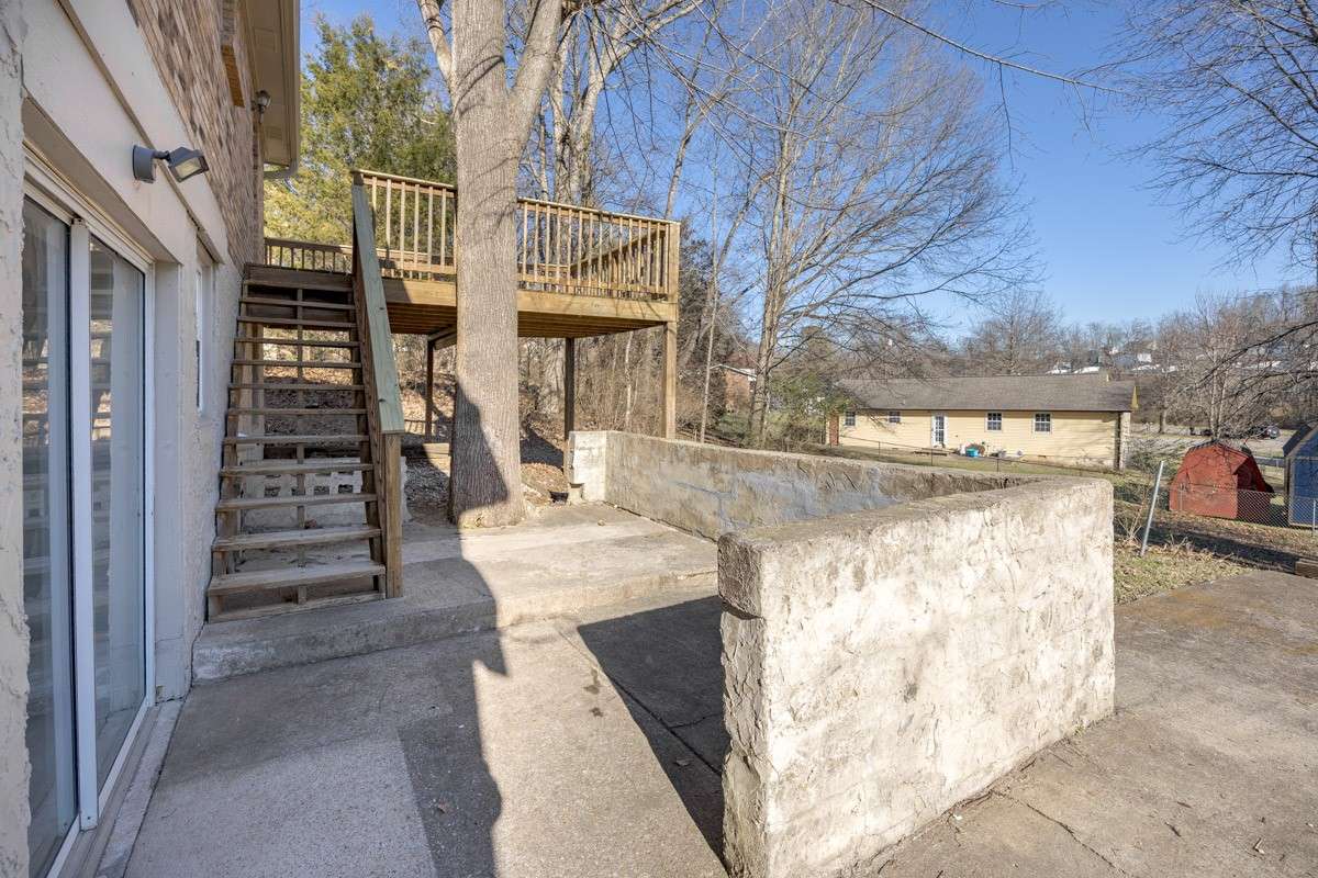 Just to the right of the garage is another outdoor space - those sliding glass doors head into the daylight basement