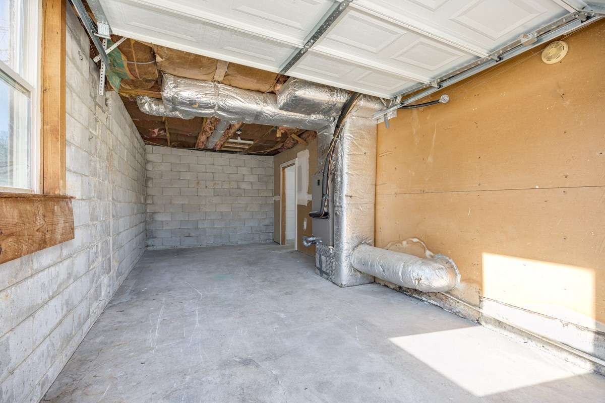 One car garage, just past the storage area - located at the back of the house