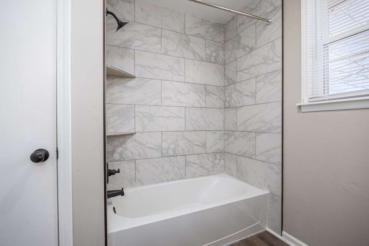 tile surround and a storage closet