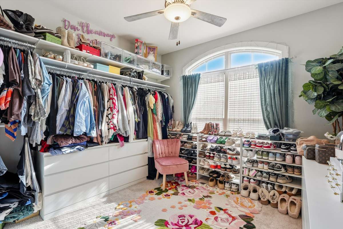 BEDROOM 2 ON THE MAIN LEVEL -- CURRENTLY USED AS A CUSTOM CLOSET SPACE BUT IS A TRUE BEDROOM!