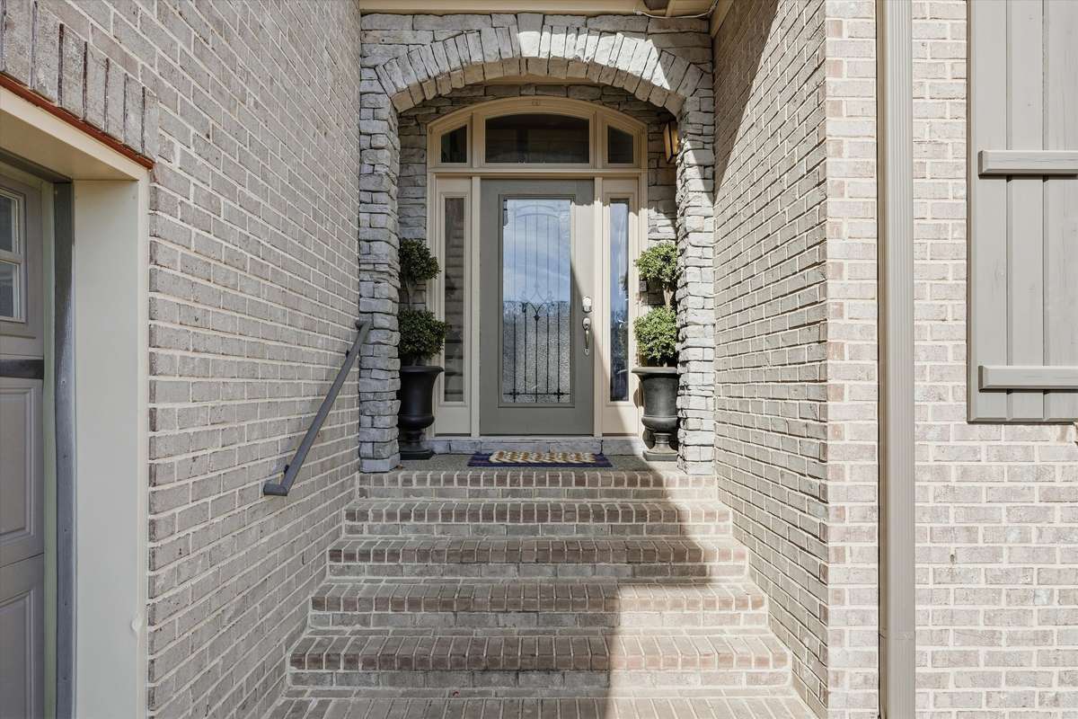 ALL BRICK HOME AND AN OVERSIZED 2 CAR SIDE ENTRY GARAGE