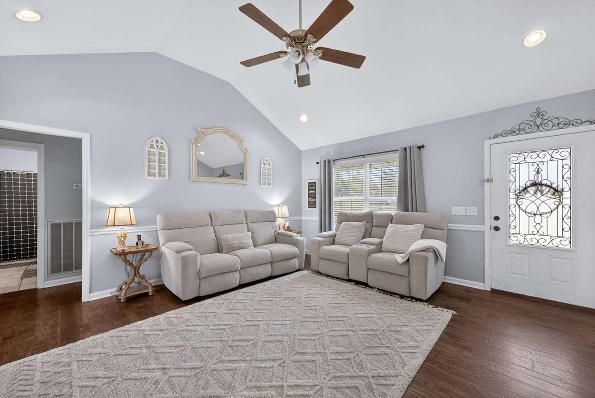 Living room has plenty of space for everyone to hangout