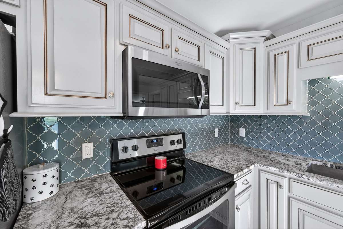 Granite counters with a gorgeous backsplash
