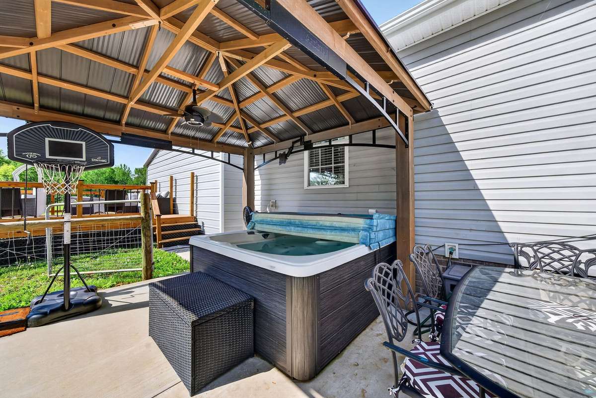 Your outdoor oasis begins here. Hot tub, gazebo, grilling out, playing yard games and basketball.