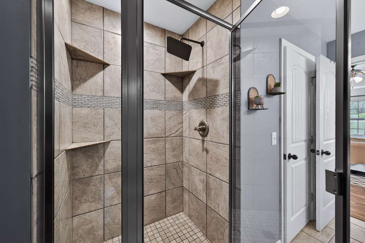 Beautiful tile shower with rain shower head