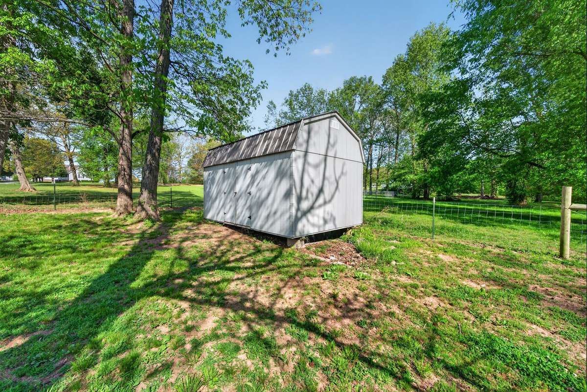 Storage barn will remain. Perfect for storing your mower and gardening tools