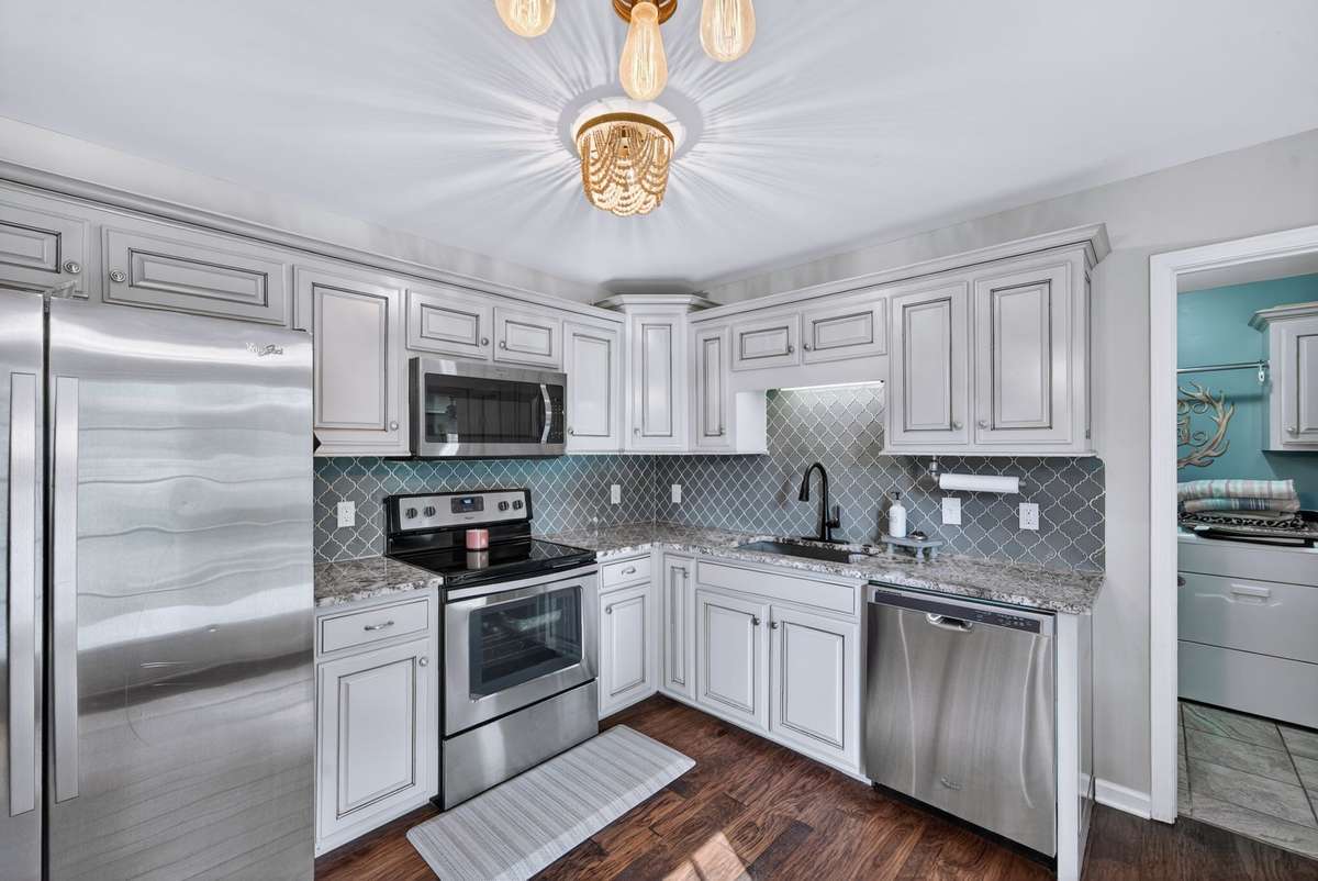 All stainless steel appliances really set off this kitchen. All will remain including the refrigerator