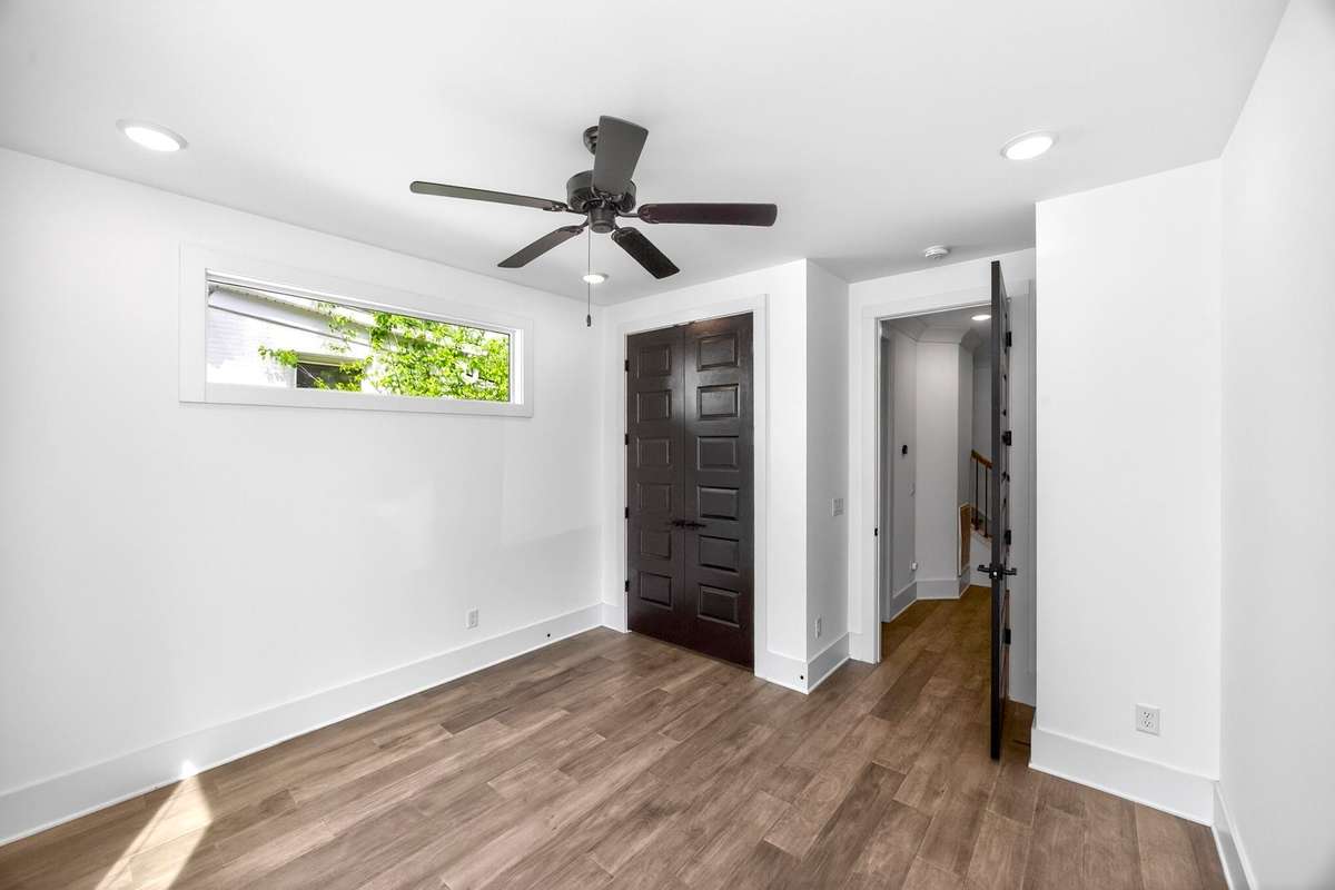 This main level bedroom offers flexibilty as a guest room or for use as a private office.