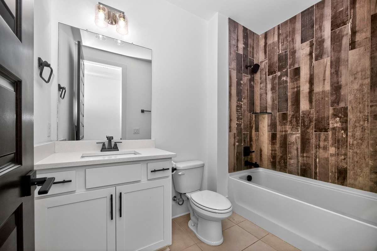There is a full bath on the main level, with an attractive tiled shower.