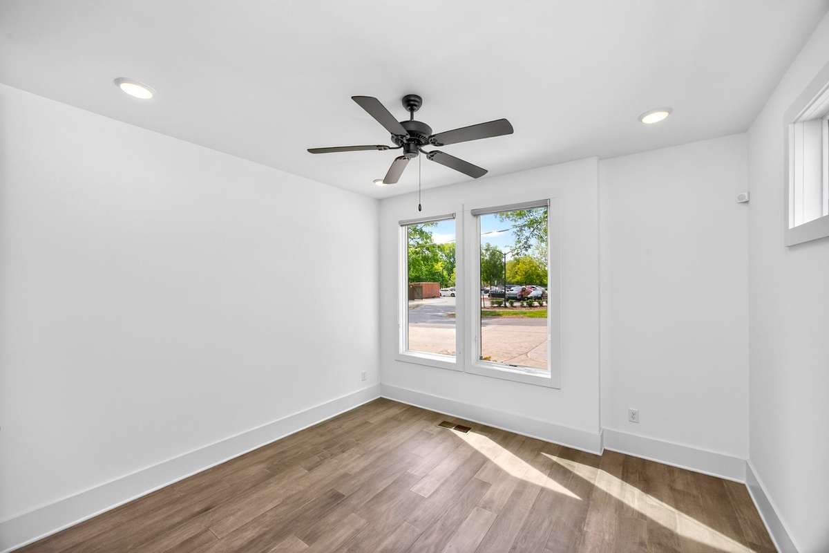 This main level bedroom offers flexibilty as a guest room or for use as a private office.