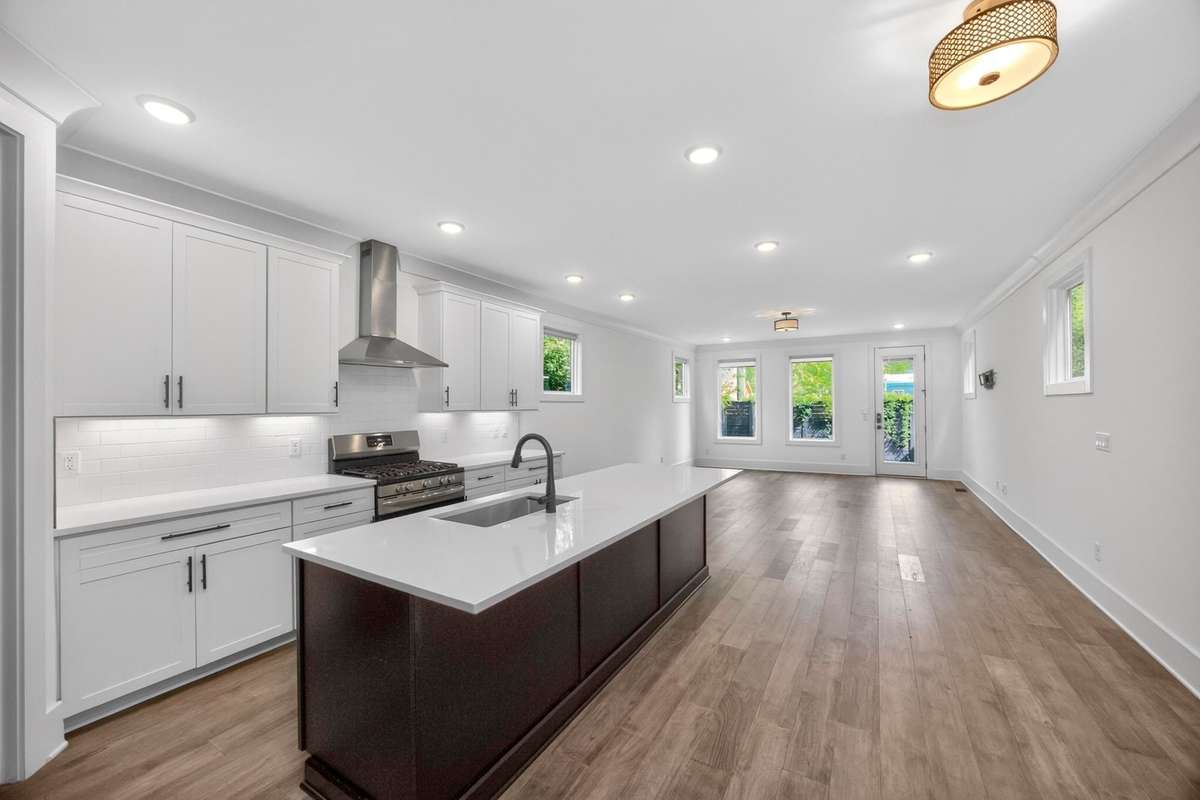 The over-sized island anchors the kitchen and can seat four comfortably.