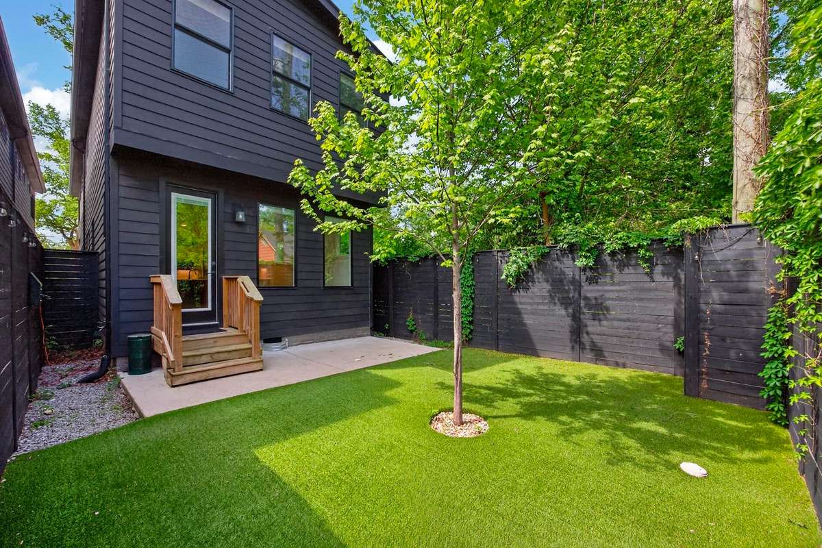 There is additional space on either side of the house, perfect for storing gardening supplies or bikes.