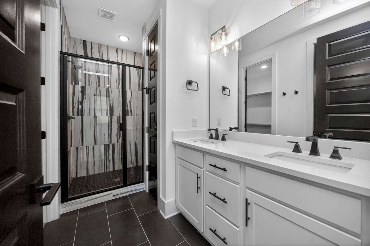 The ensuite primary bath has double vanities and plenty of counter space.