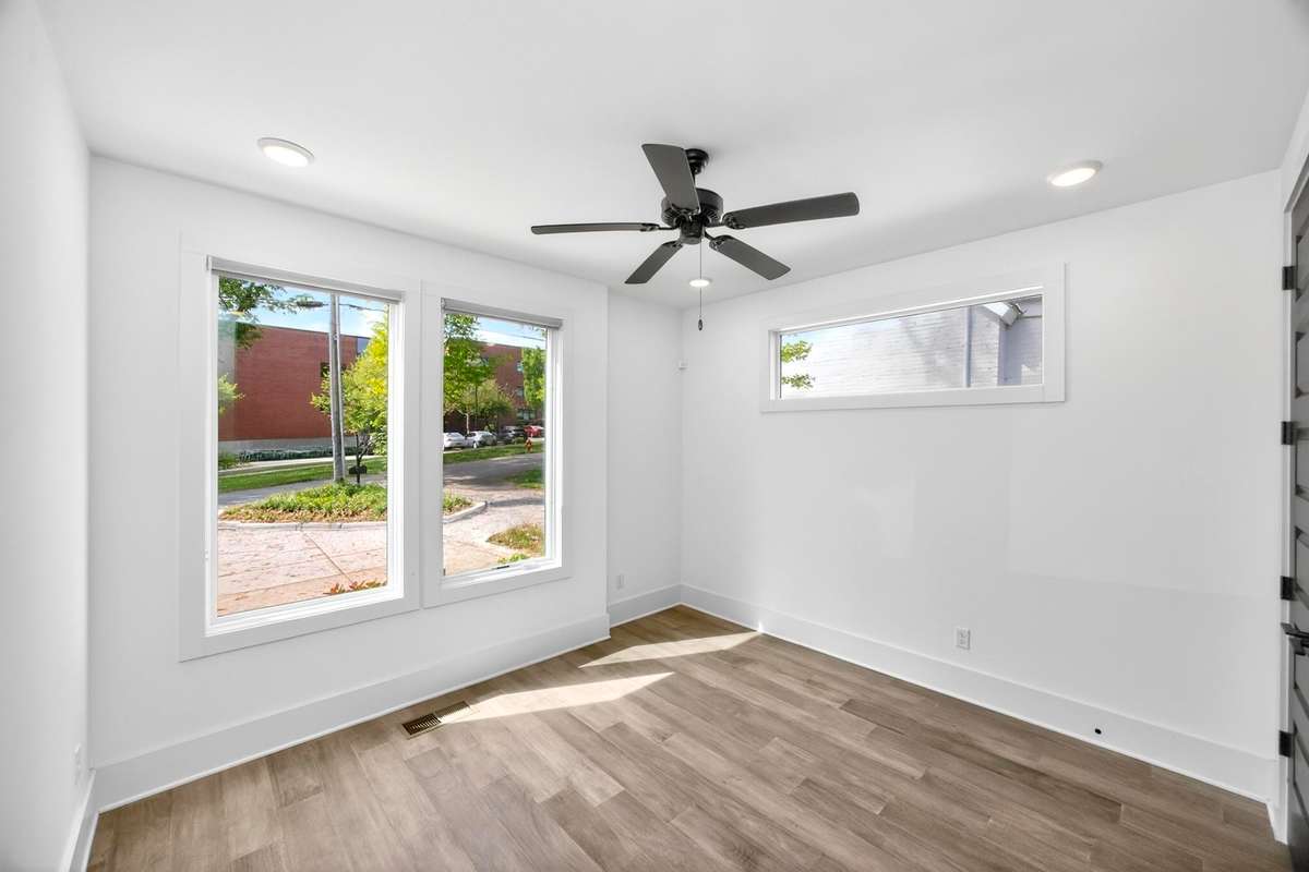 This main level bedroom offers flexibilty as a guest room or for use as a private office.