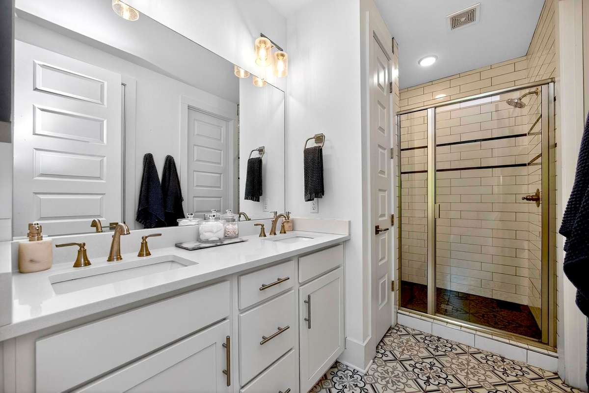The ensuite primary bath has double vanities and plenty of counter space.