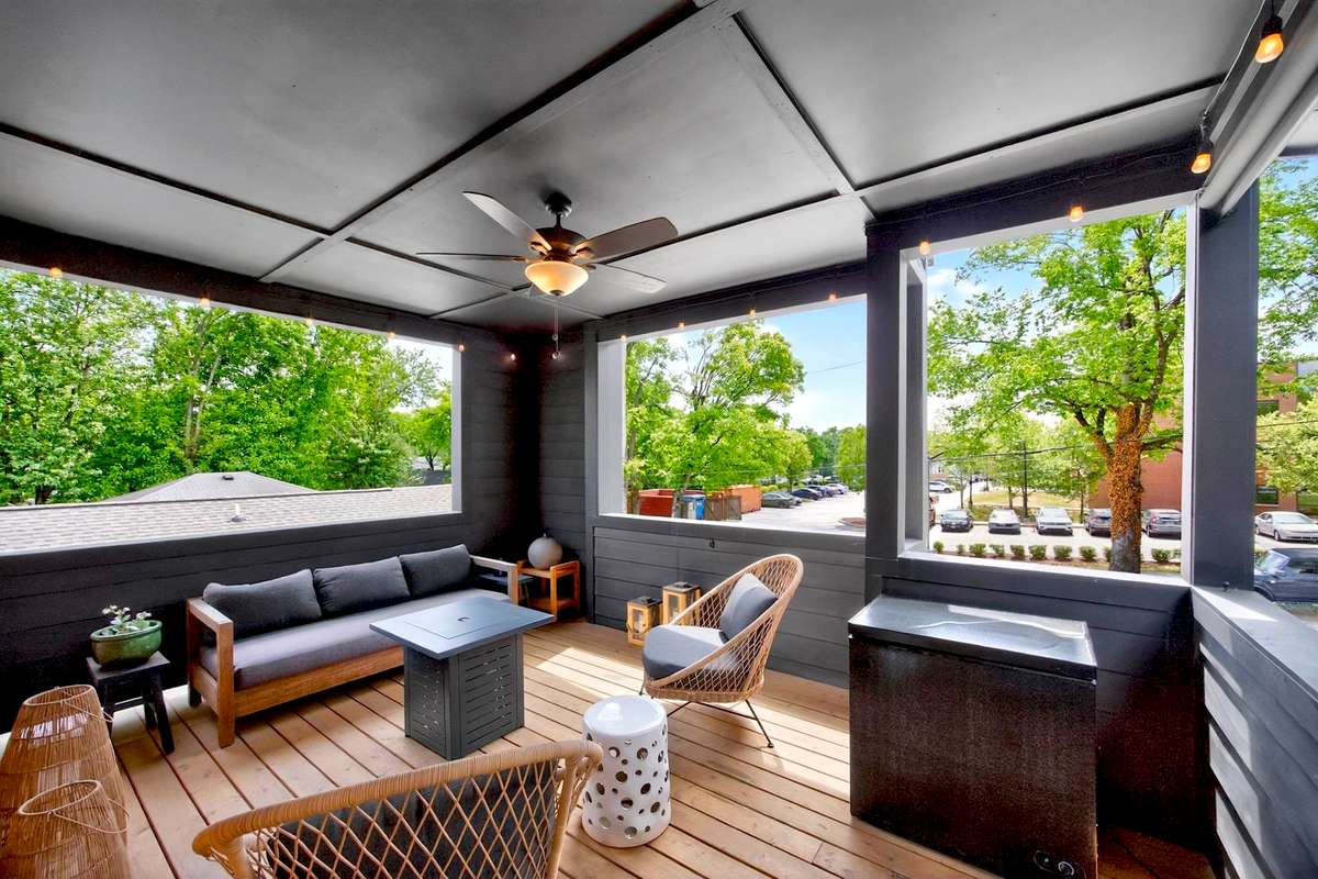 The huge covered second-story veranda, with its views of the tree-lined streets below, is terrific setting for outdoor relaxation.