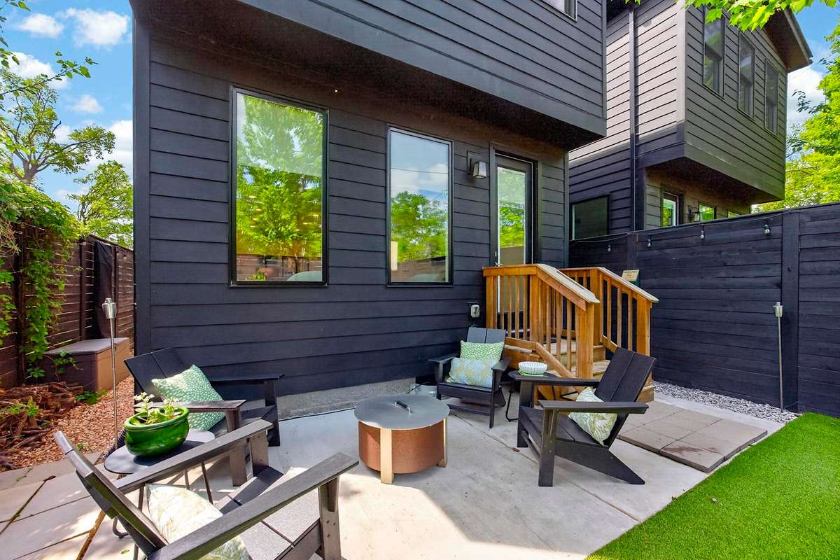 There is additional space on either side of the house, perfect for storing gardening supplies or bikes.