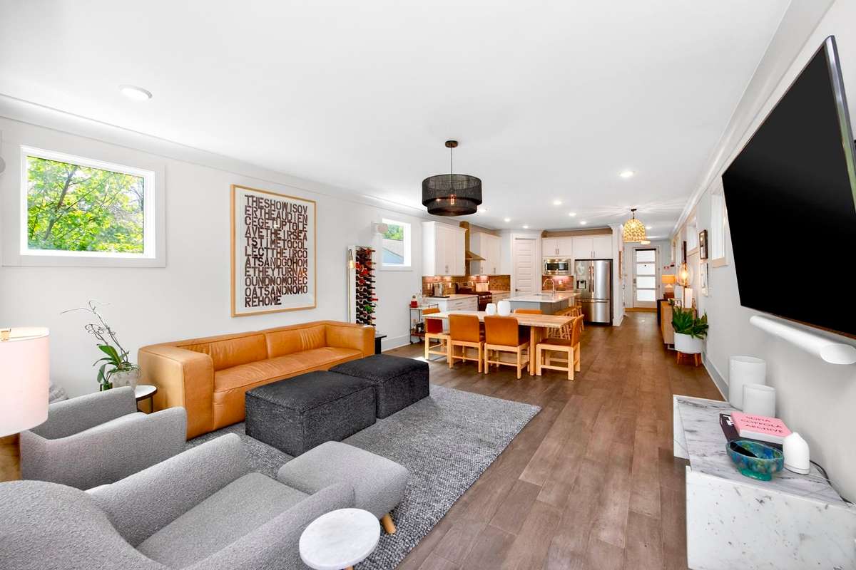 The open concept layout allows for a graceful transition into the living room space.