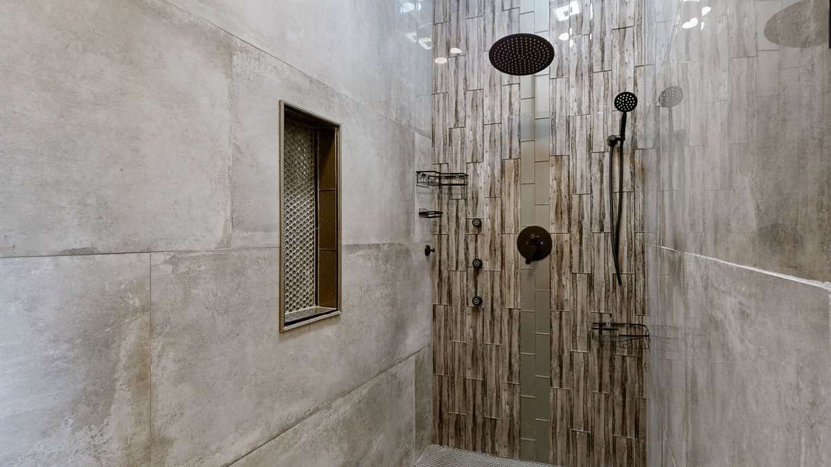 The shower is huge and beautiful tile.
