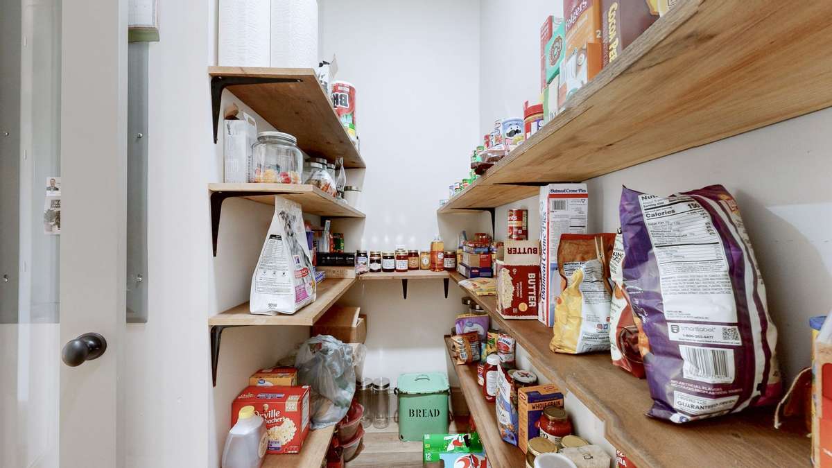 View of the pantry which is in the kitchen.