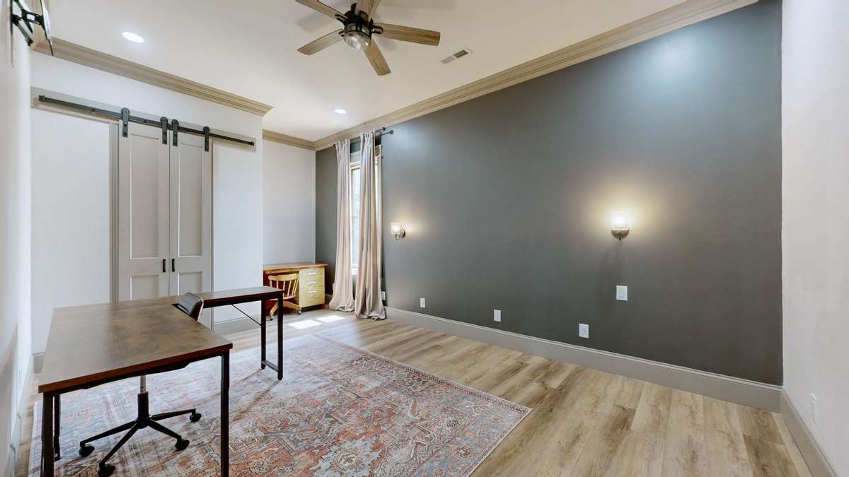 This is Bedroom #2 that is on the front side of the house.   It is being used for an office right now.