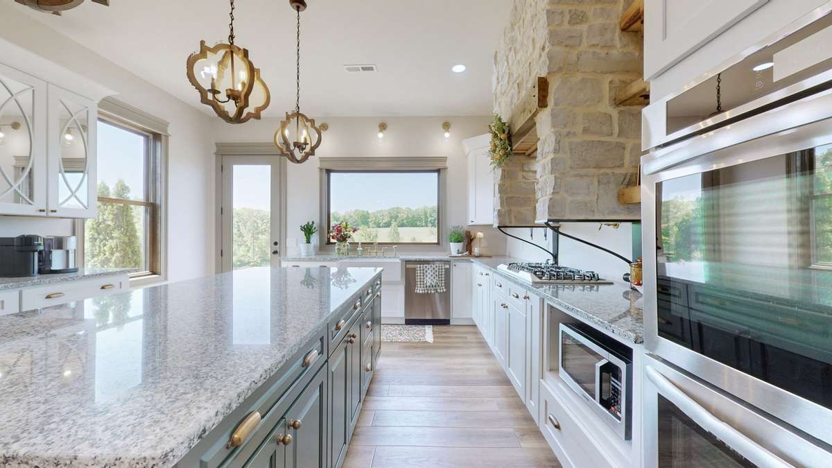 There is alot of light in the kitchen, lots of beautiful cabinets, and lots of storage.