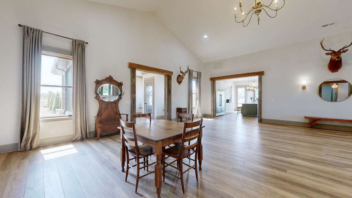 There are many, many possibilities of what you can do with this huge room.   There is plenty of room to put a large table with lots of chairs, a hutch, a buffet or whatever you want.