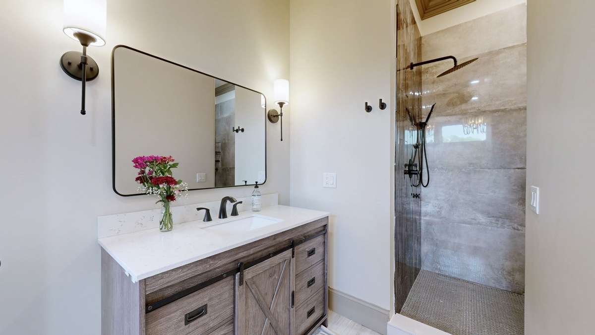 Master bathroom showing one vanity and the entrance t this huge shower...