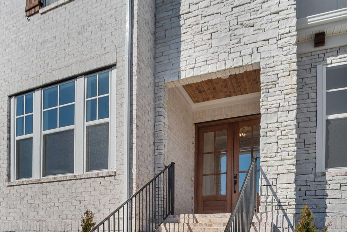 Double entry wood front doors welcome you.