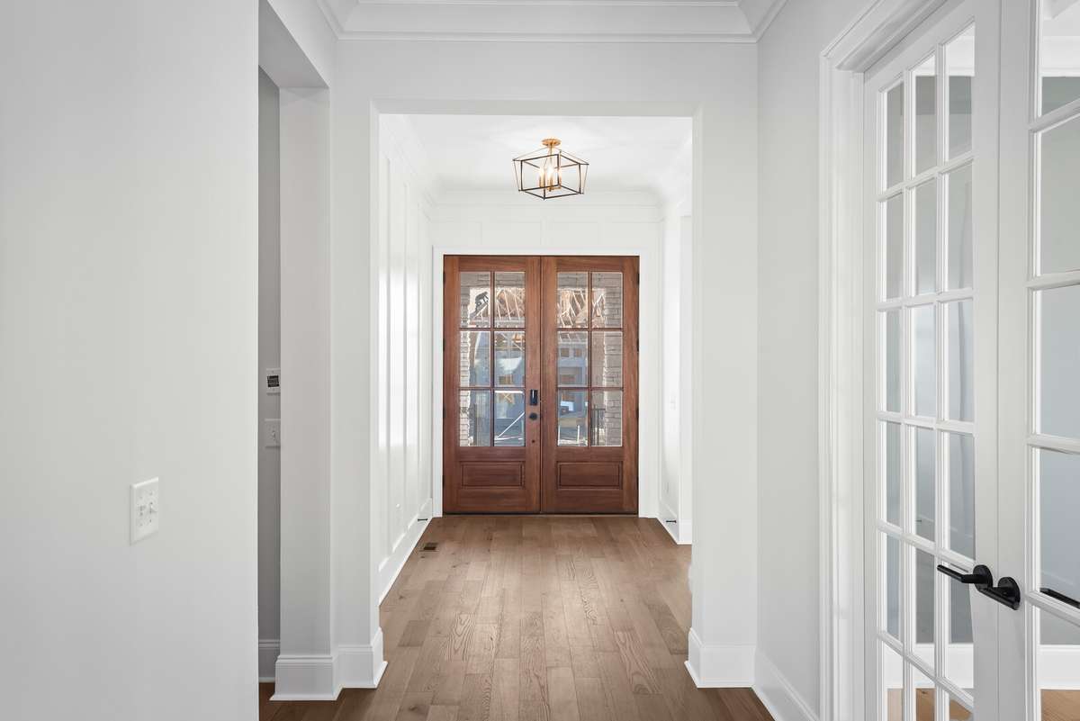 A first floor Guest Suite and Home Office are located off of the main foyer. The Primary suite is also located on the main level.