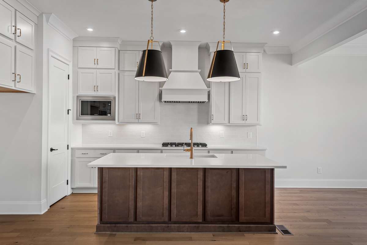 Stacked cabinets to the ceiling make for an impressive impact in this Kitchen.